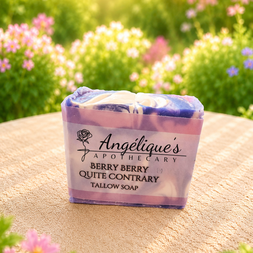 Berry Berry tallow bar of soap with 'Angélique's Apothecary' branding against a natural background with flowers.